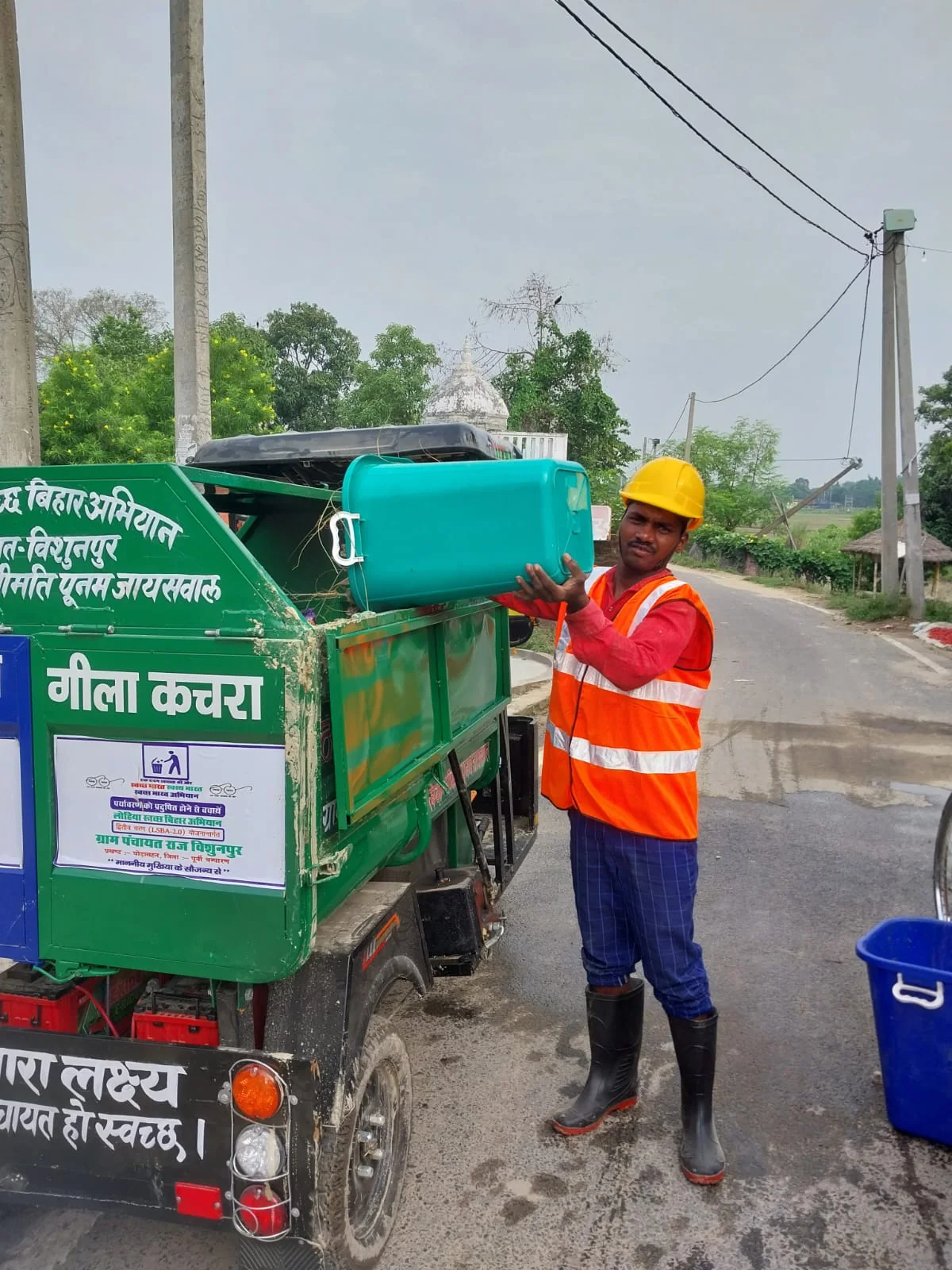 Sanitation worker collecting segregated household waste