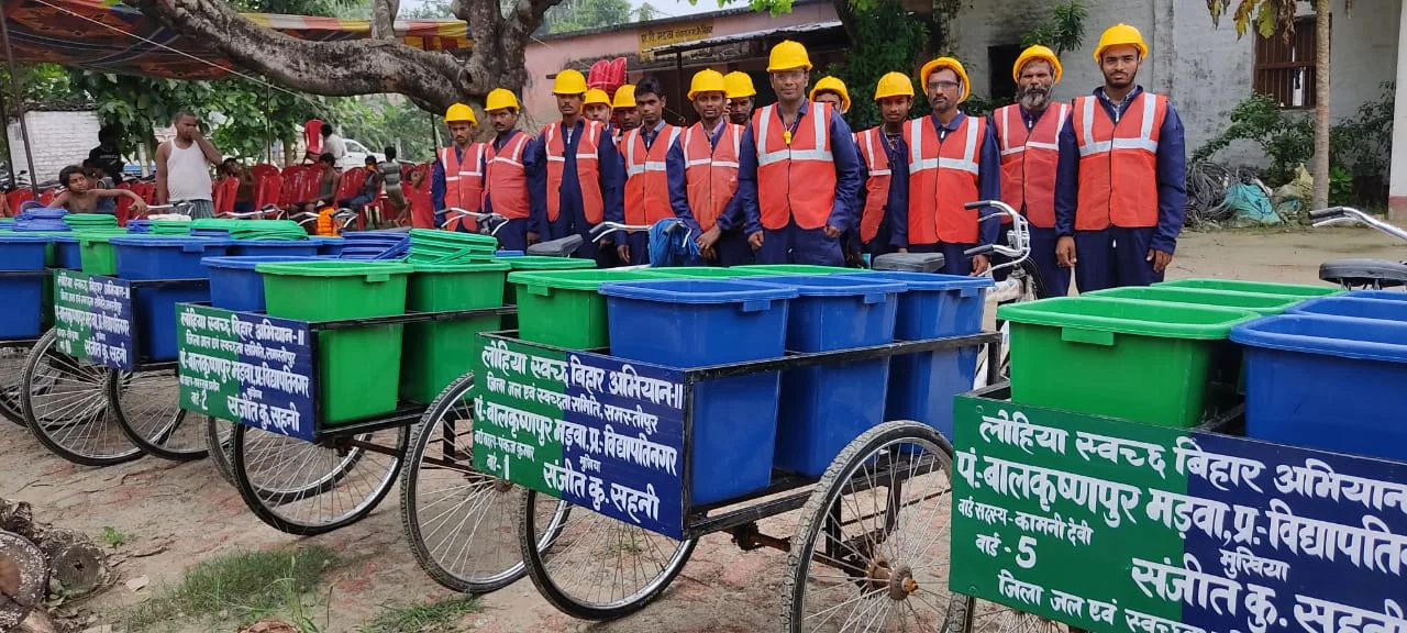 LSBA sanitation team with waste collection carts